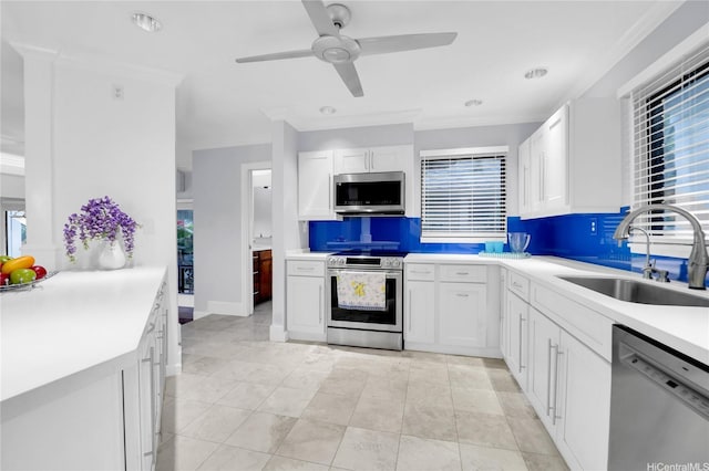 382 Kuanalu Pl, Honolulu, HI 96825 - kitchen featuring appliances with stainless steel finishes, a sink, healthy amount of natural light, ceiling fan, and ornamental molding