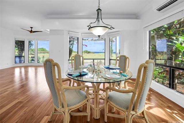 382 Kuanalu Pl, Honolulu, HI 96825 - dining space with an AC wall unit, plenty of natural light, wood finished floors, and ornamental molding