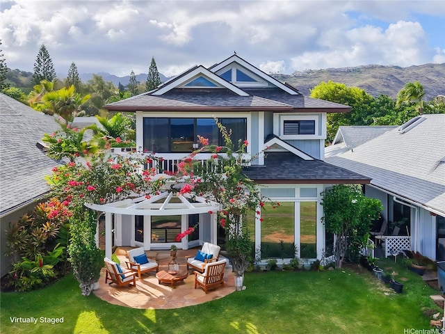 382 Kuanalu Pl, Honolulu, HI 96825 - back of property with an outdoor living space, a mountain view, a patio area, and a lawn