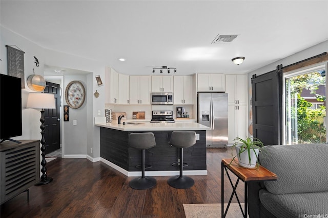 91-422 Makalea St Unit 94, Ewa Beach, HI 96706 - kitchen featuring stainless steel appliances, a sink, light countertops, baseboards, and dark wood-style flooring