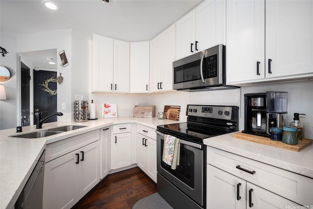 91-422 Makalea St Unit 94, Ewa Beach, HI 96706 - kitchen featuring stainless steel appliances, a sink, dark wood-style flooring, white cabinets, and light stone countertops