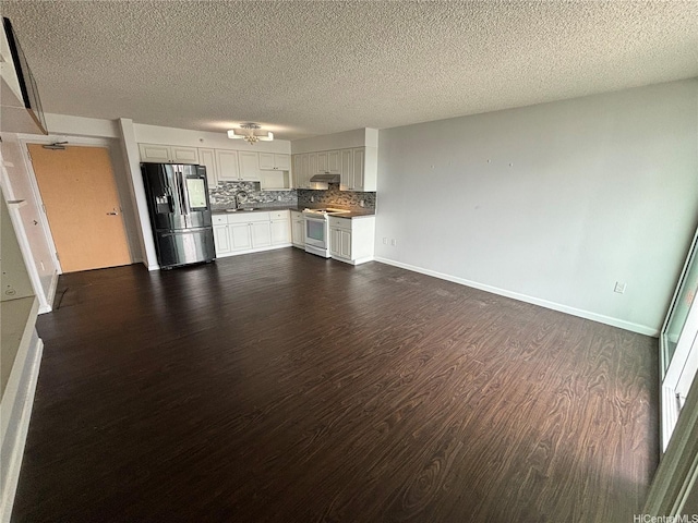 801 S St Unit 1723, Honolulu, HI 96813 - unfurnished living room featuring dark wood-style floors, a sink, a textured ceiling, and baseboards