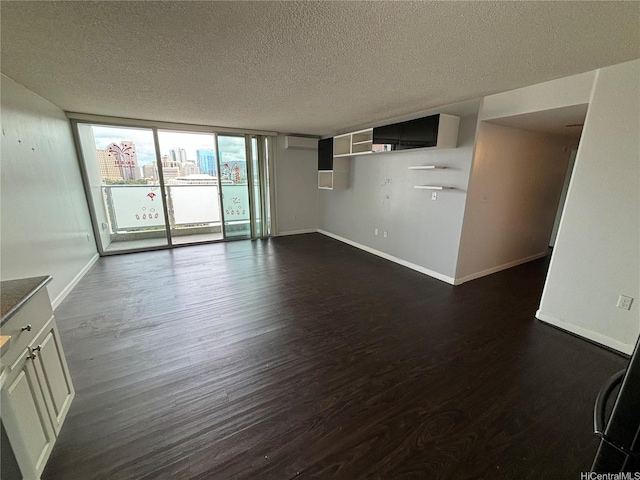 801 S St Unit 1723, Honolulu, HI 96813 - unfurnished living room with dark wood-type flooring, a textured ceiling, baseboards, and expansive windows