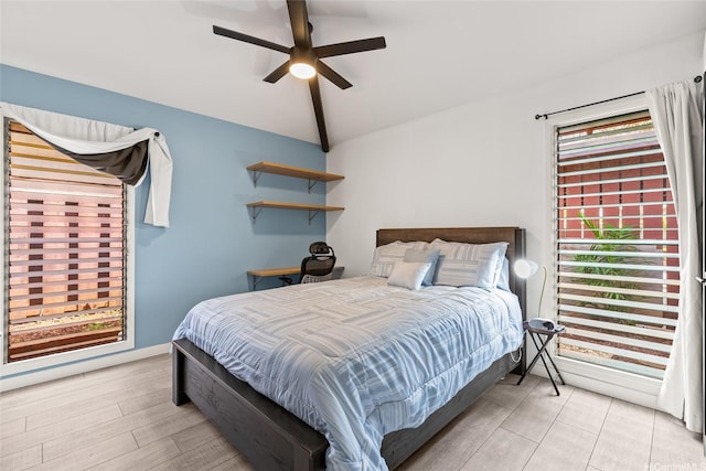 94-265 Anania Dr, Mililani, HI 96789 - bedroom with vaulted ceiling, ceiling fan, and light wood-style flooring