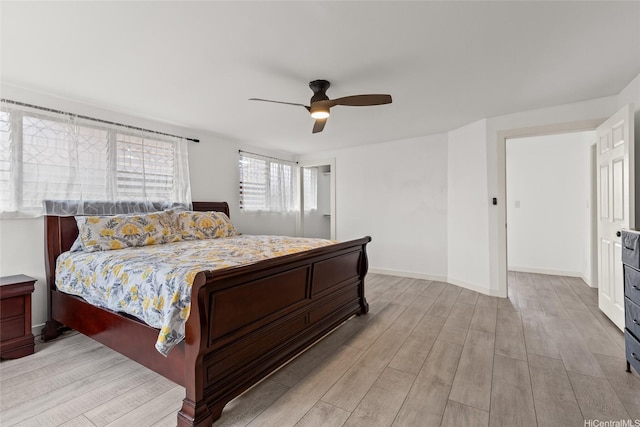 94-265 Anania Dr, Mililani, HI 96789 - bedroom featuring light wood finished floors, ceiling fan, and baseboards