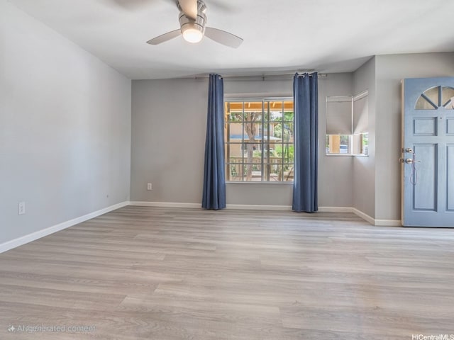 91-1066 Makaaloa St Unit 14D, Ewa Beach, HI 96706 - spare room featuring ceiling fan, wood finished floors, and baseboards