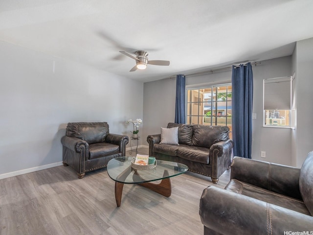 91-1066 Makaaloa St Unit 14D, Ewa Beach, HI 96706 - living area with light wood-style floors, a ceiling fan, and baseboards