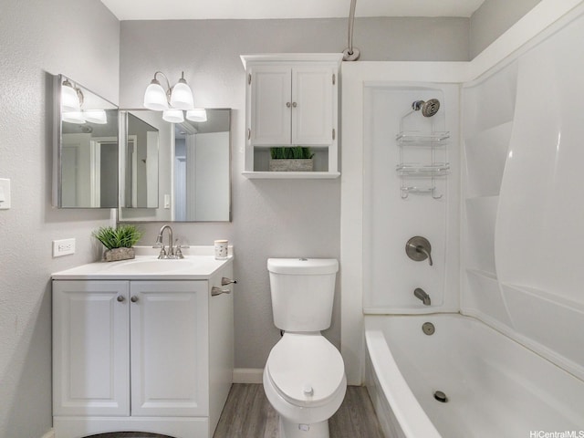 91-1066 Makaaloa St Unit 14D, Ewa Beach, HI 96706 - bathroom with wood finished floors,  shower combination, vanity, toilet, and baseboards
