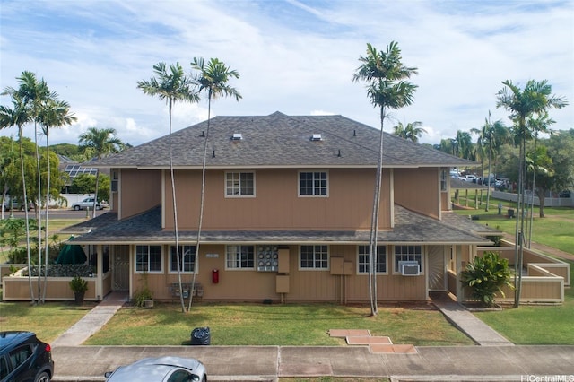 91-1066 Makaaloa St Unit 14D, Ewa Beach, HI 96706 - rear view of house featuring a shingled roof and a lawn