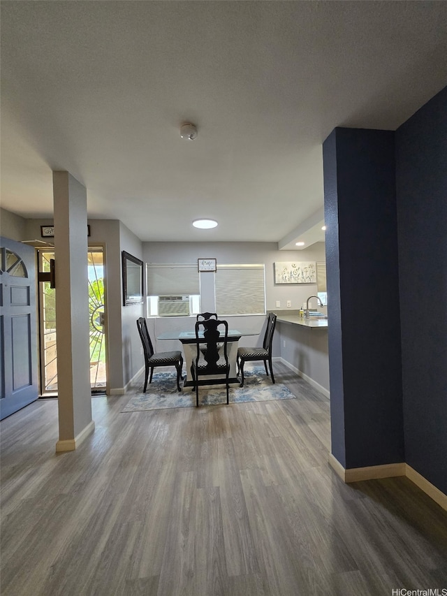 91-1066 Makaaloa St Unit 14D, Ewa Beach, HI 96706 - dining area featuring baseboards and wood finished floors
