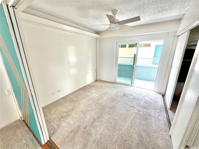 410 Nahua St Unit 404, Honolulu, HI 96815 - carpeted spare room with ceiling fan and a textured ceiling