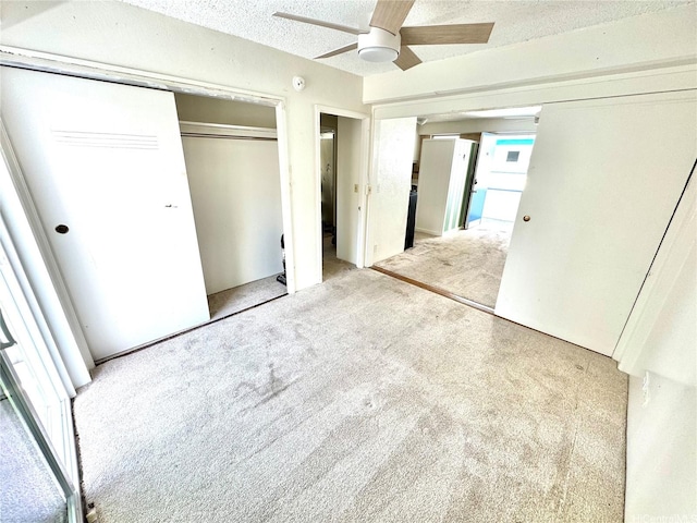 410 Nahua St Unit 404, Honolulu, HI 96815 - unfurnished bedroom with carpet, a closet, ceiling fan, and a textured ceiling