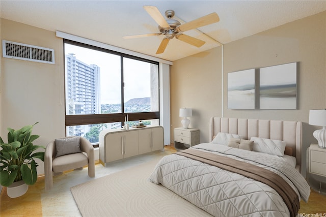 300 Wai Nani Way Unit 1101, Honolulu, HI 96815 - bedroom featuring expansive windows, ceiling fan, and a mountain view