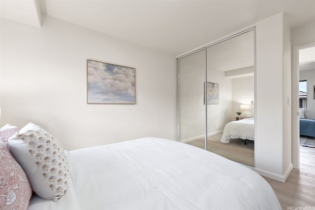 95-1204 Moea St Unit 48, Mililani, HI 96789 - bedroom featuring light wood-style flooring, a closet, and baseboards