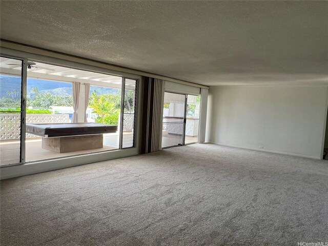 118 Kalalau St, Honolulu, HI 96825 - carpeted spare room featuring a textured ceiling