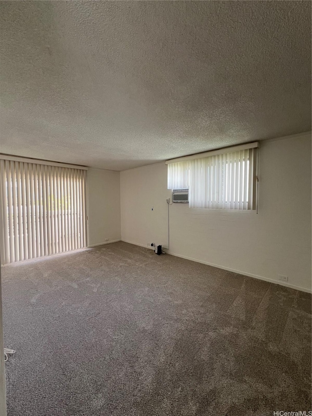 118 Kalalau St, Honolulu, HI 96825 - spare room featuring carpet flooring, a textured ceiling, and baseboards