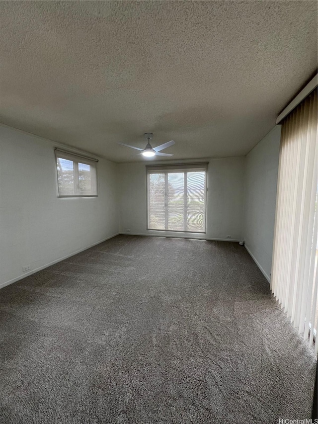 118 Kalalau St, Honolulu, HI 96825 - empty room with healthy amount of natural light, ceiling fan, a textured ceiling, carpet floors, and baseboards