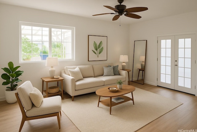 51-470 Lihimauna Rd, Kaaawa, HI 96730 - living room featuring light wood-type flooring, ceiling fan, french doors, and baseboards