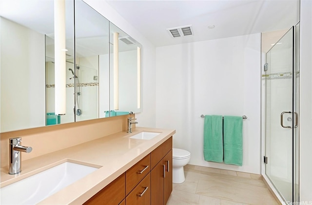 555 S St Unit 2905, Honolulu, HI 96813 - bathroom featuring a stall shower, double vanity, and toilet