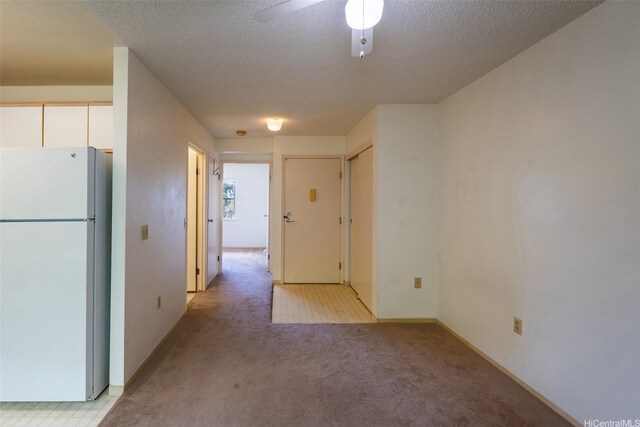 95-1045 Kaapeha St Unit 172, Mililani, HI 96789 - hall featuring light colored carpet and a textured ceiling