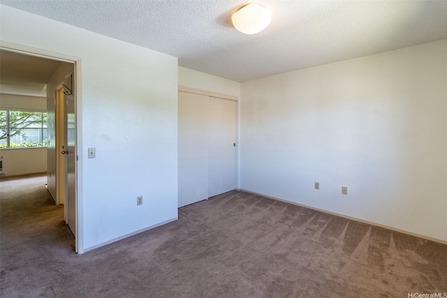 95-1045 Kaapeha St Unit 172, Mililani, HI 96789 - unfurnished bedroom with carpet flooring, a closet, and a textured ceiling