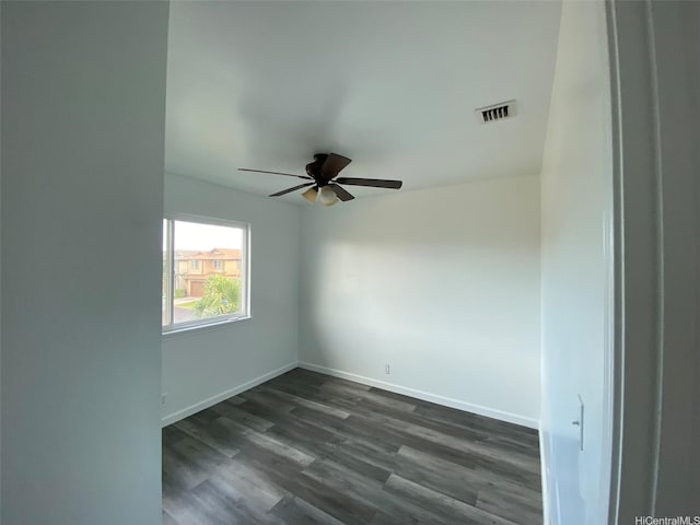 91-1001 Keaunui Dr Unit 441, Ewa Beach, HI 96706 - spare room with dark wood finished floors, ceiling fan, and baseboards
