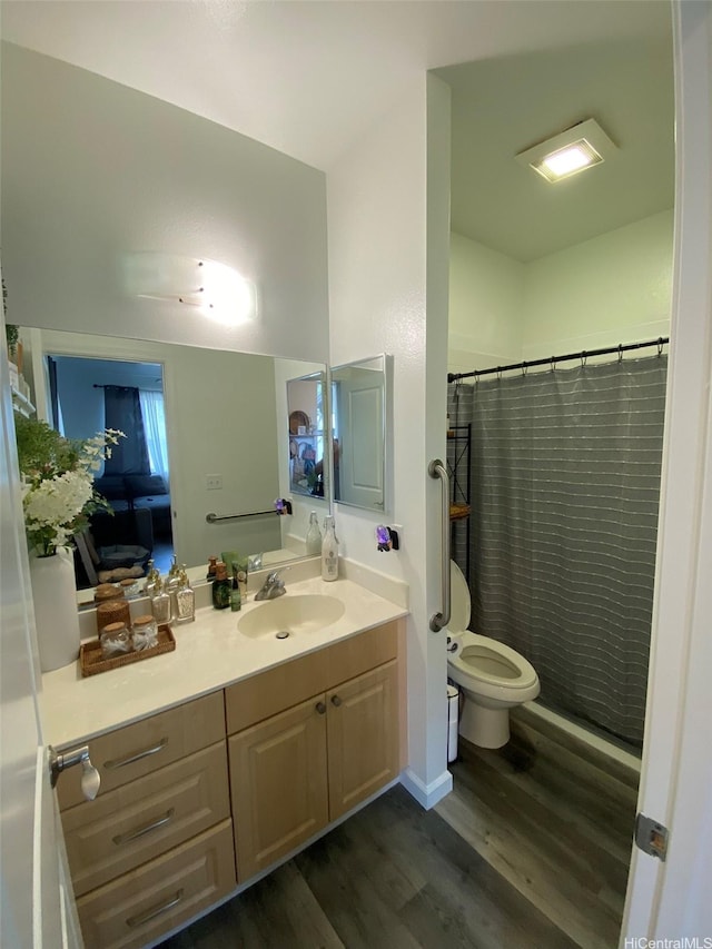 91-1001 Keaunui Dr Unit 441, Ewa Beach, HI 96706 - full bathroom with wood finished floors, vanity, toilet, and a shower with shower curtain