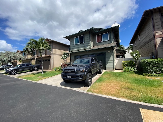 91-1001 Keaunui Dr Unit 441, Ewa Beach, HI 96706 - view of front of home with driveway, a garage, and a front lawn