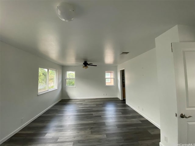 91-1001 Keaunui Dr Unit 441, Ewa Beach, HI 96706 - spare room with healthy amount of natural light, ceiling fan, and dark wood finished floors