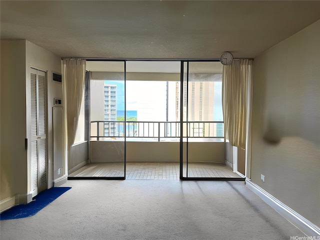 1778 Ala Moana Blvd Unit 1502, Honolulu, HI 96815 - unfurnished bedroom with carpet, baseboards, and a wall of windows
