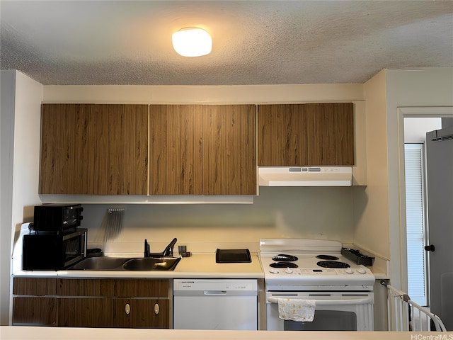 1778 Ala Moana Blvd Unit 1502, Honolulu, HI 96815 - kitchen featuring under cabinet range hood, electric range, dishwashing machine, stainless steel microwave, and a sink
