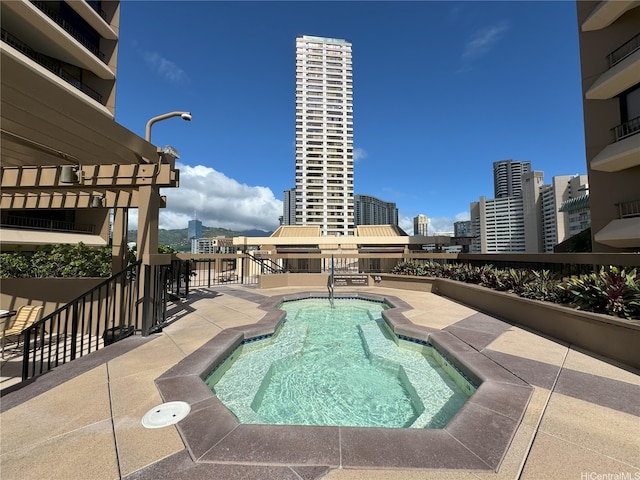 1778 Ala Moana Blvd Unit 1502, Honolulu, HI 96815 - view of swimming pool featuring a view of city, a swimming pool, and a patio area