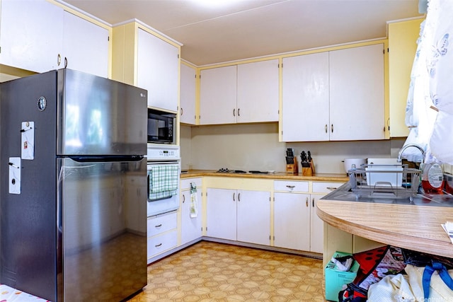1164 Manulani St, Kailua, HI 96734 - kitchen with white appliances, light countertops, and light flooring