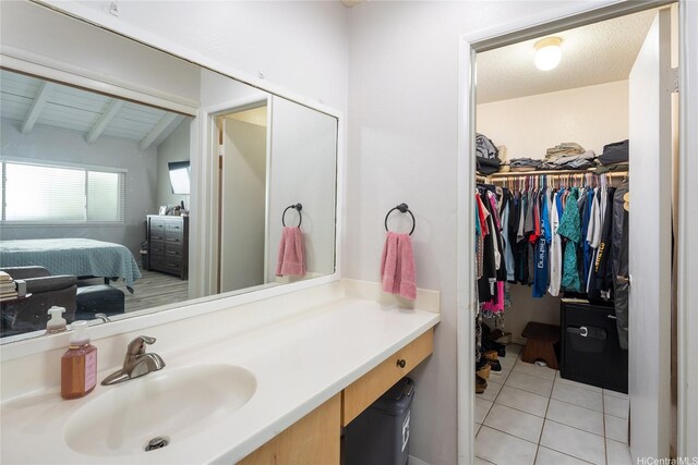 7549 Puumahoe Pl, Honolulu, HI 96825 - ensuite bathroom featuring tile patterned flooring, vanity, and a spacious closet