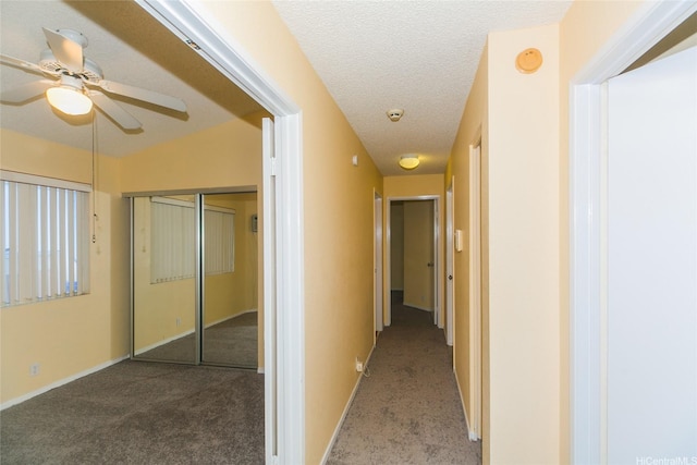 91-1006 Wahineomao Pl, Ewa Beach, HI 96706 - hallway with carpet floors, a textured ceiling, and baseboards