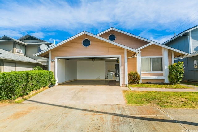 91-1006 Wahineomao Pl, Ewa Beach, HI 96706 - view of front facade featuring driveway, a garage, and washer / dryer