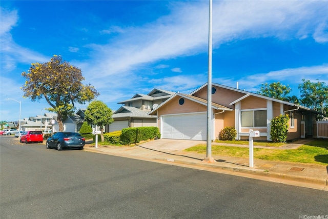 91-1006 Wahineomao Pl, Ewa Beach, HI 96706 - view of front facade featuring a garage and concrete driveway