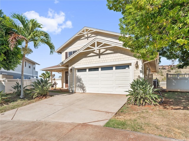 92-308 Palaulau Pl Unit 70, Kapolei, HI 96707 - view of front facade with fence, driveway, and an attached garage