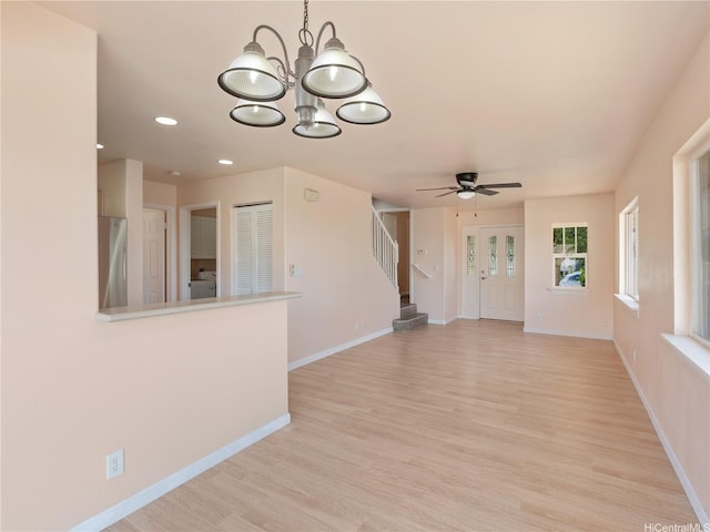 92-308 Palaulau Pl Unit 70, Kapolei, HI 96707 - unfurnished living room featuring stairs, light wood-type flooring, a chandelier, baseboards, and recessed lighting