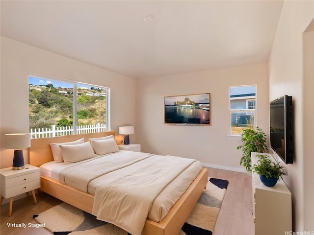 92-308 Palaulau Pl Unit 70, Kapolei, HI 96707 - bedroom featuring wood finished floors and baseboards