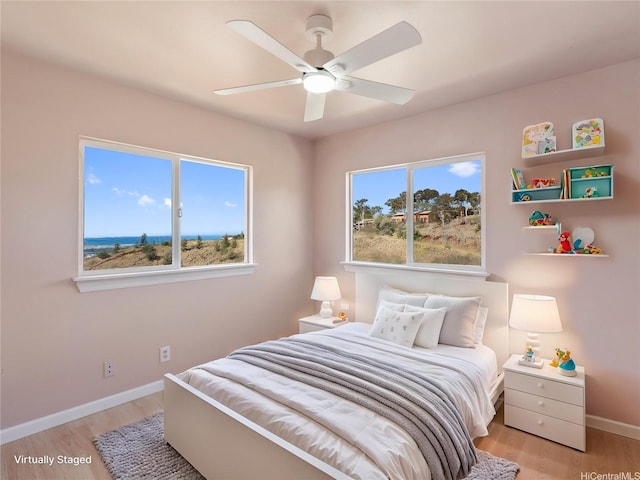 92-308 Palaulau Pl Unit 70, Kapolei, HI 96707 - bedroom with light wood finished floors, baseboards, and a ceiling fan