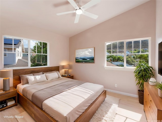 92-308 Palaulau Pl Unit 70, Kapolei, HI 96707 - bedroom with lofted ceiling, baseboards, light wood-style floors, and a ceiling fan