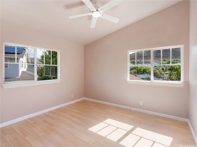 92-308 Palaulau Pl Unit 70, Kapolei, HI 96707 - empty room with lofted ceiling, wood finished floors, baseboards, and a ceiling fan