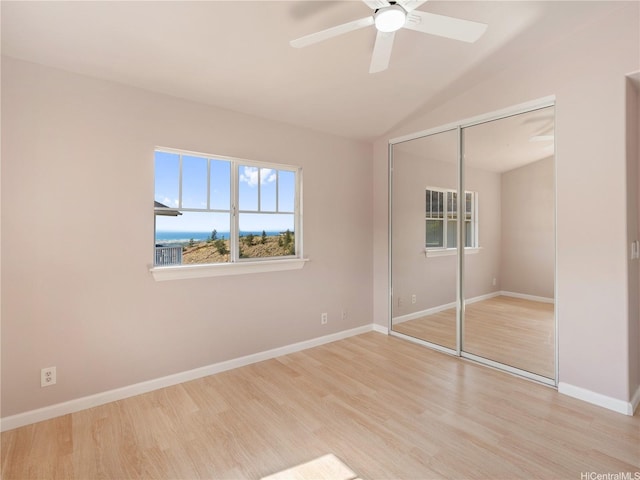 92-308 Palaulau Pl Unit 70, Kapolei, HI 96707 - unfurnished bedroom with wood finished floors, a closet, baseboards, lofted ceiling, and a ceiling fan