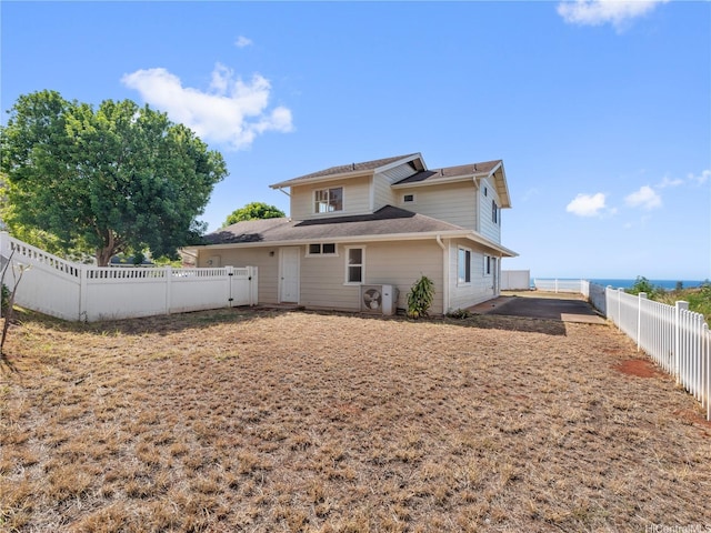 92-308 Palaulau Pl Unit 70, Kapolei, HI 96707 - back of property with a fenced backyard and roof with shingles