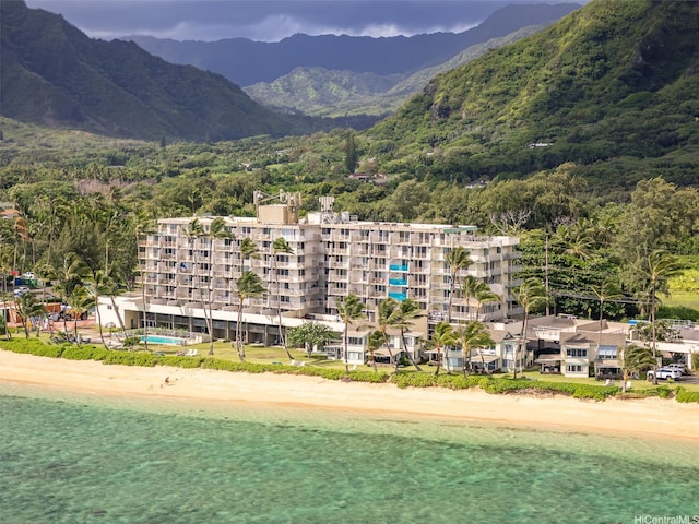 53-567 Kamehameha Hwy Unit 503, Hauula, HI 96717 - view of mountain backdrop with waterfront with a beach and a forest