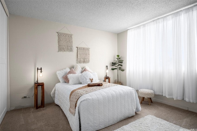 1670 Kalakaua Ave Unit 803, Honolulu, HI 96826 - bedroom with carpet floors, a textured ceiling, and concrete block wall