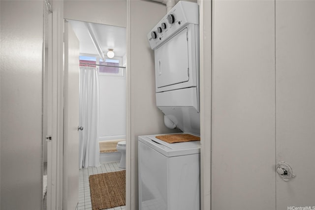 1670 Kalakaua Ave Unit 803, Honolulu, HI 96826 - clothes washing area with estacked washer and dryer and tile patterned floors