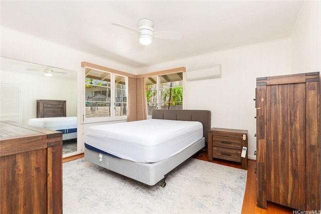 3115 Kaunaoa St, Honolulu, HI 96815 - bedroom with an AC wall unit, wood finished floors, and ceiling fan