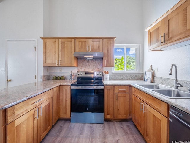 45-812 Kupohu St, Kaneohe, HI 96744 - kitchen with stainless steel electric range oven, dishwashing machine, under cabinet range hood, a towering ceiling, and light wood-type flooring